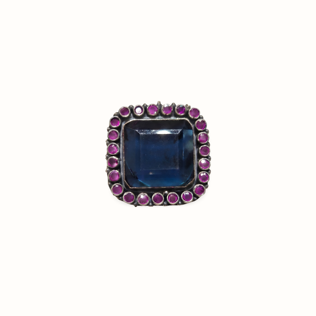 The Main Character — Blue Topaz & Ruby Cocktail Ring in Oxidised Silver