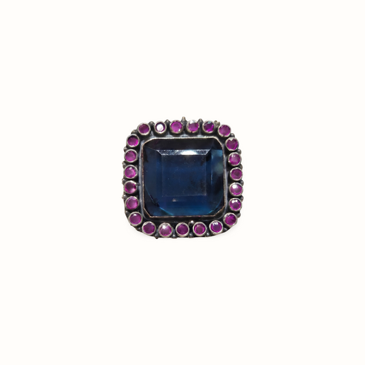 The Main Character — Blue Topaz & Ruby Cocktail Ring in Oxidised Silver
