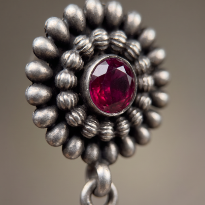 Full Bloom — Floral Jhumka in Oxidised Silver with Ruby Cabochon